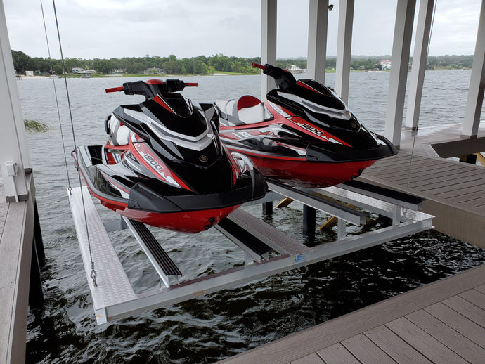 A double PWC cradle with two jet skis in a boat house lift